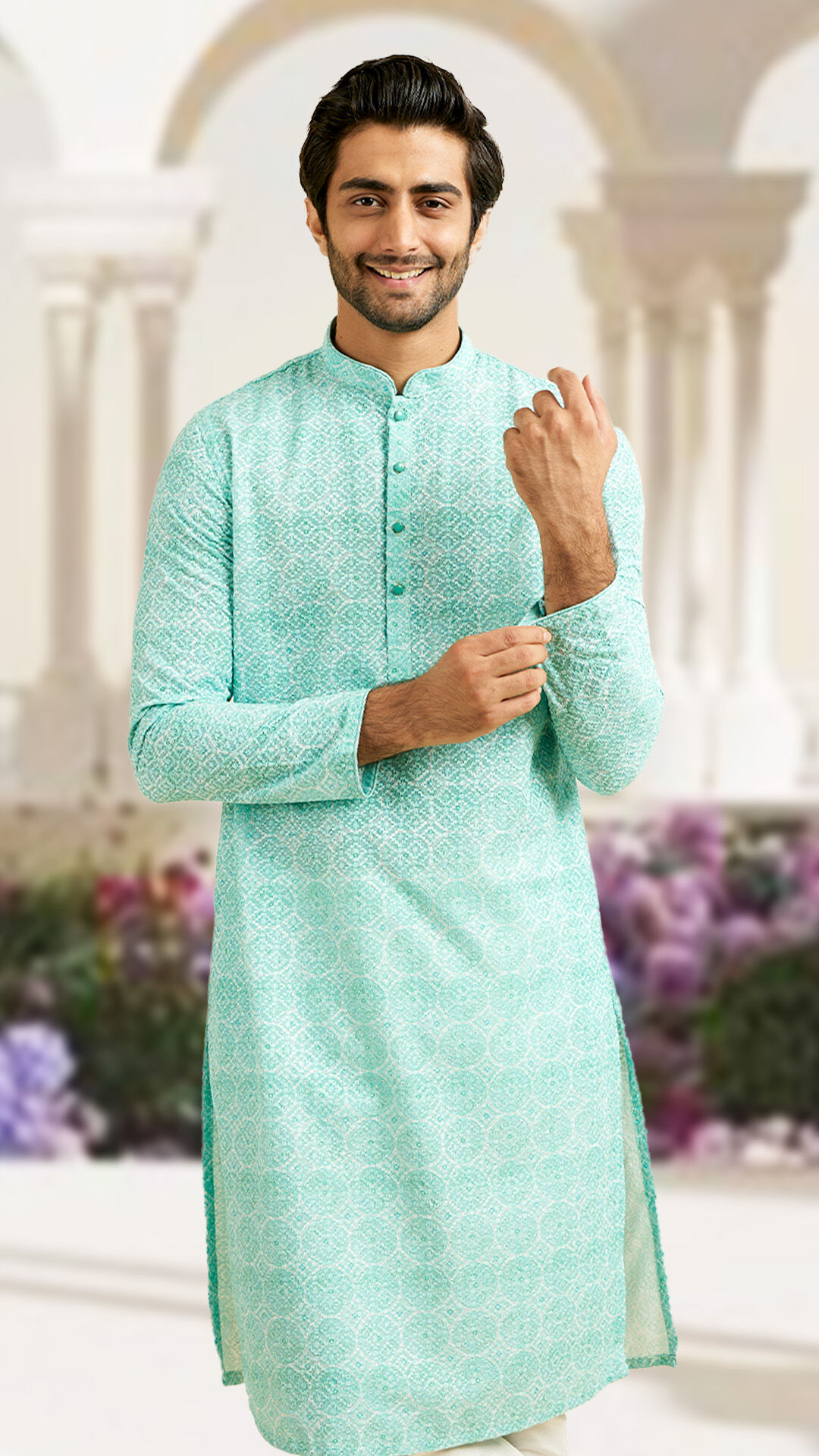 Man wearing a light blue printed kurta for a fresh, festive look.